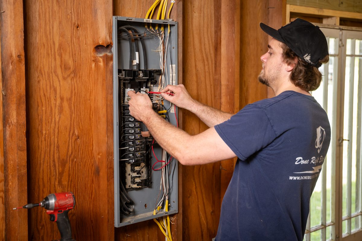 Open breaker panel with new circuits being wired in